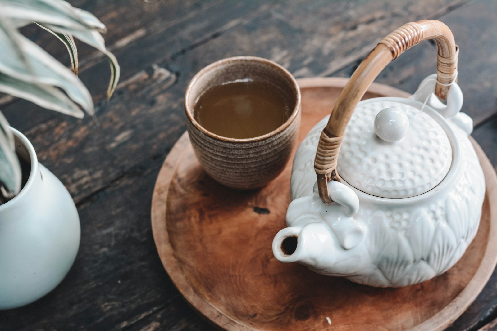 Mizo woman in traditional attire pouring tea